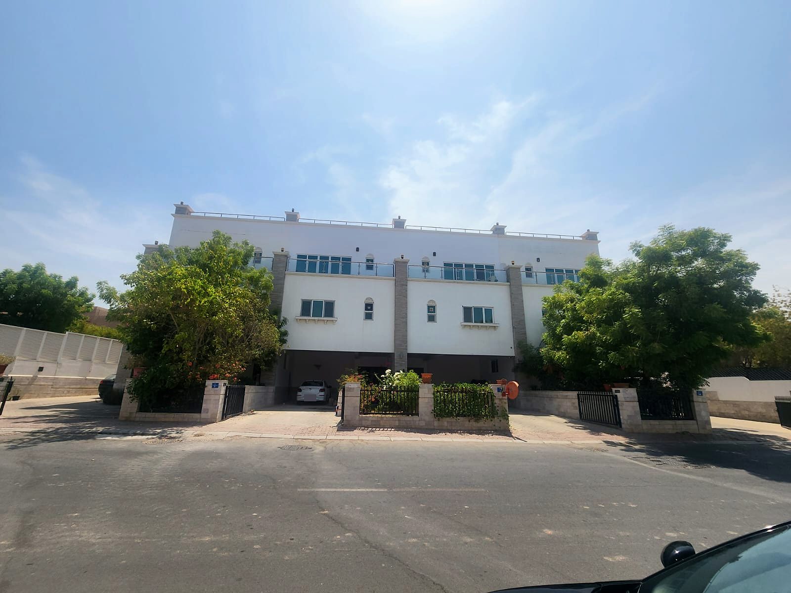 Manahil Complex facade and garden, Madinat Al Sultan Qaboos · 2